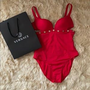 Red Versace swim suit.